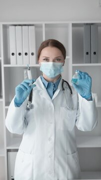 A medical expert who demonstrates expertise and efficiency in conducting a syringe injection medical procedure. The pharmaceutical industry: the invention of a new drug