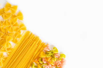 Variety of types and shapes of Italian pasta on a white background
