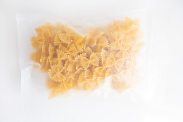 Food Macaroni or pasta in packet on white background.
