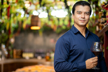 Smart Businessman Enjoying Wine Tasting in Winery Store - Relaxed, Confident, and Stylish, Surrounded by Fine Selections, Perfect for Wine Enthusiast Concepts, with Space for Text