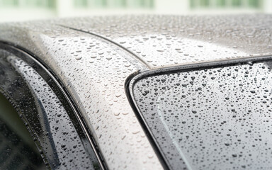 Car in parking with
water drop rainy, foggy autumn day. Focus on car roof.
Concept of safety driving problem.