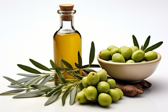 A bottle of olive oil and a bowl of olives