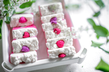 Handmade natural eco-friendly raspberry berry soap with raspberry scent on white background.