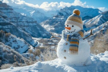 Obraz premium Snowman in a hat and scarf on the mountain