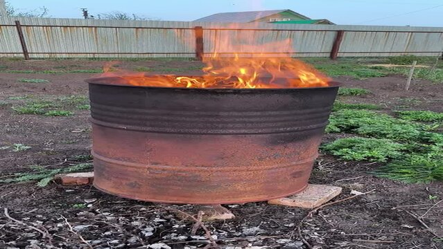 burning garbage in a barrel