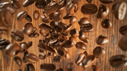 Freeze motion of flying coffee beans on old wooden planks