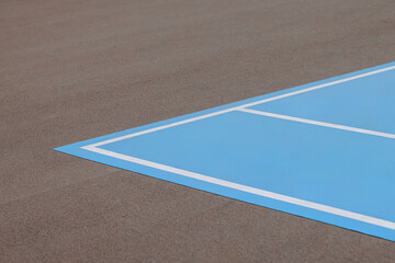 A blue and white tennis court with a white line. High quality photo