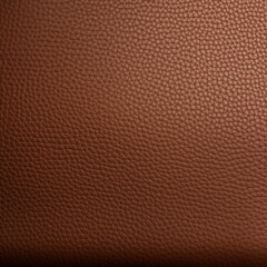 Fototapeta premium Close-up view of textured leather background ginger leather showing the quality of plane leather