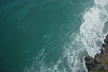 waves crashing on a rock