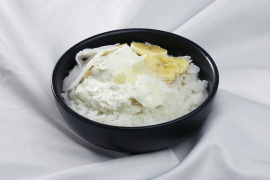Doi Chira, traditional Bengali healthy and cool summer food. Main ingredient are water soaked flatten rice and curd. Others are Sugar, Salt, Banana slices, Coconut etc.