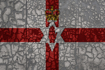 flag of northern ireland on a grunge vintage metal rusty cracked wall background