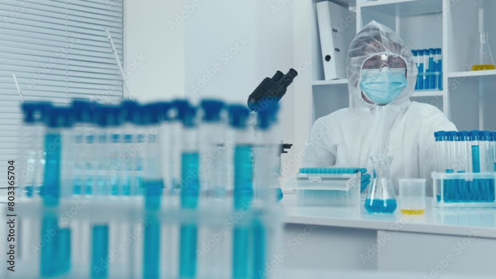 Aufkleber A medical scientist works in a laboratory. The process of creating and testing vaccines to ensure herd immunity and fight infectious diseases. Introducing the world of biomedical engineering, where