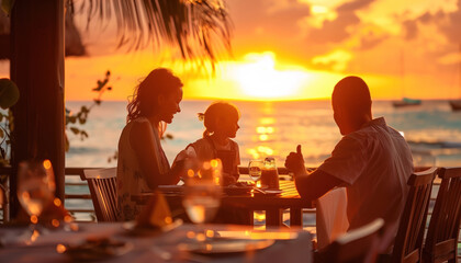 Close-up of family on holiday or vacation eating near a beach a la carte with the blue sea in the background
