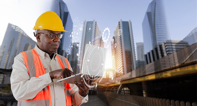 Double exposure engineering working on laptop with digital technology interfaces icon and modern building city background, Smart industry and digital technology and IOT software concept.