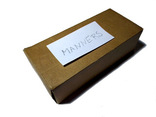 Brown box with message Manners