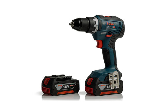 Lyon, France - February 6, 2024: Bosch cordless drill driver power tool with spare 18V battery pack, isolated on a white background with copy space;