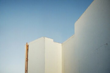 building with blue sky and clouds