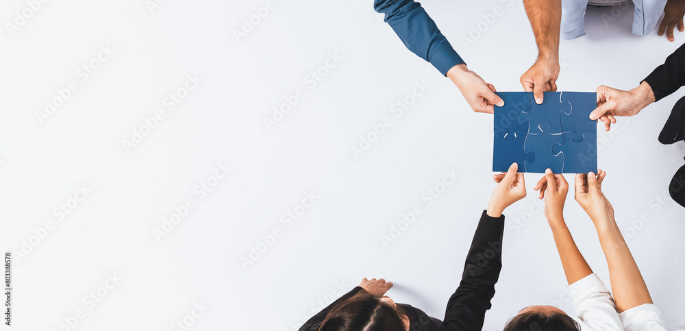 Fototapete Top view panorama banner of business team joining jigsaw puzzle together over meeting table symbolize business partnership and collective unity teamwork in problem solving solution. Prudent