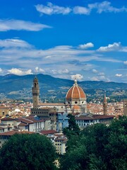 The majestic view of the Duomo in Florence, Italy, where the iconic cathedral's Renaissance architecture and towering dome dominate the cityscape, symbolizing the rich cultural heritage and artistic l