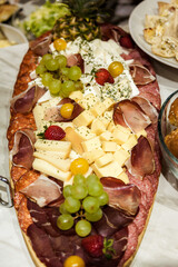 Table decorated with food and salads. Plenty of food on the table. Business event with a table full of food and salads. Catering table full of tasty food.
