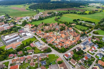 Aerial view around the old town of the city Lichtenau in Germany on a cloudy day in Spring