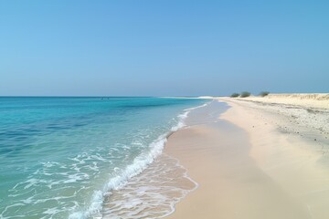 Sandy Beach With Clear Blue Water on a Sunny Day