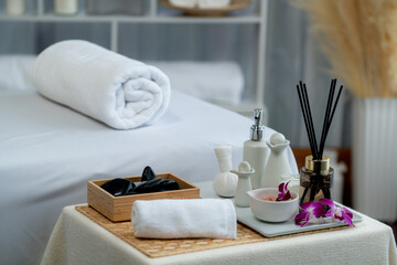 Exquisite display of beauty treatment and spa salon accessories arranged on spa table in luxury spa...