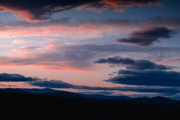 Orange and blue sky early in the morning during sunrise.