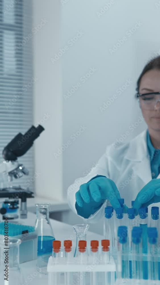Poster in the laboratory, an experimental geneticist modifies the genomes of organisms to study their funct