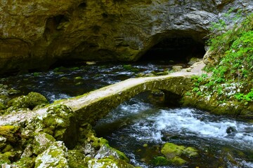 Stone bridge over Rak river at Zelške jame caves at Rakov Škocjan, Notranjska, Slovenia