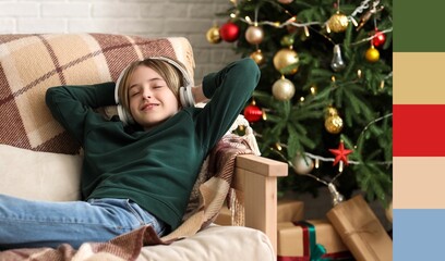 Cute little boy listening to Christmas music at home. Different color patterns