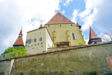 Fototapeta premium Bottom-up view of the fortified Biertan Church - an important historical and architectural landmark of Transylvania (Romania)