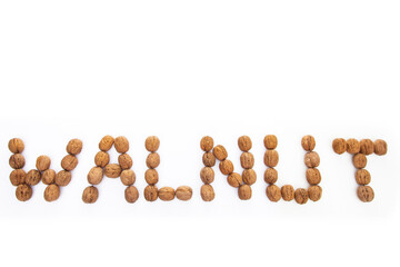 Walnut lettering from walnuts on a white background