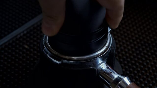 The Barista Manually Fills the Coffee Into the Portafilter