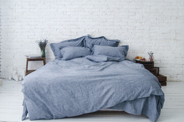 Textile. Beautiful solid color bedding on a double bed in the interior