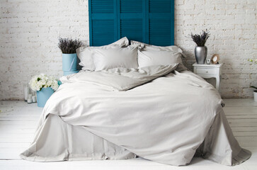 Textile. Beautiful solid color bedding on a double bed in the interior