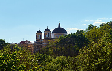 Serene Roman Catholic Church of St. Alexander Parish. The church's towering spires pierce the clear blue sky.