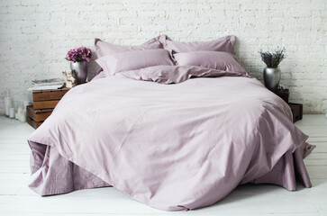 Textile. Beautiful solid color bedding on a double bed in the interior