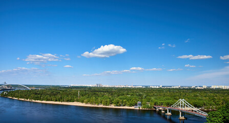 Fototapeta premium Panoramic view of the Dnipro River and the pedestrian bridge to Trukhanov Island in Kyiv, Ukraine.