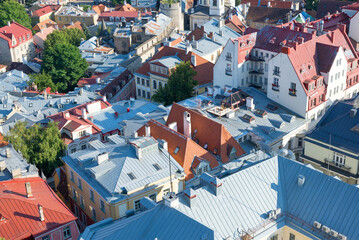 top view of rusty and red tile roofs of city Tallinn, Estonia