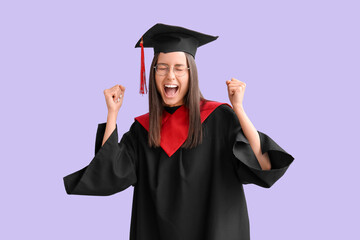 Cheerful female graduate on lilac background
