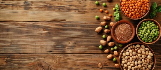 Vegan protein sources displayed on a wooden background with space for text.
