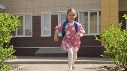 child kid girl daughter running school backpack, returning from school from lessons, children education school yard house running leg, fun with motion, elementary child fun, childhood enjoyment