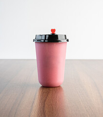 A glass of strawberry smoothie