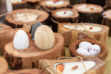A collection of wooden egg holders and candle holders