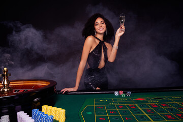 Photo of stunning attractive girl millionaire winning all in poker raise champagne glass