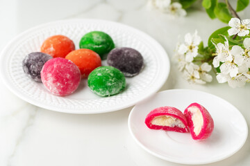 Multi-colored Japanese cakes Mochi in a white plate