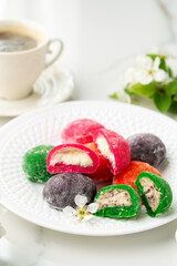 Multi-colored Japanese cakes Mochi in a white plate