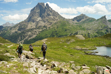 Group of experienced hikers hiking in beautiful mountains in Pyrenees (Lacs d' Ayous), popular route, France