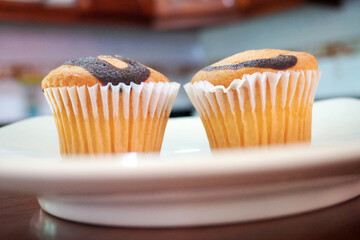 Amateur cooking. Homemade muffins. Portioned cupcakes.